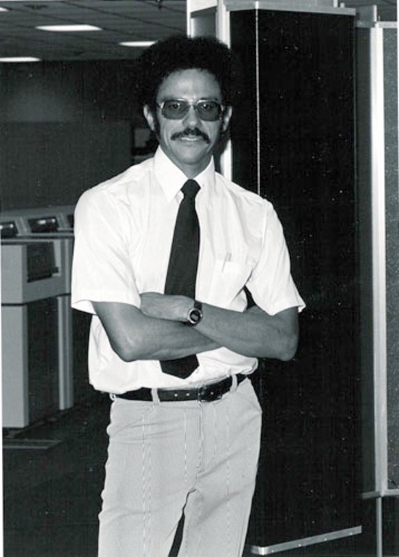 Warren standing in front of one of the first Cray computers.