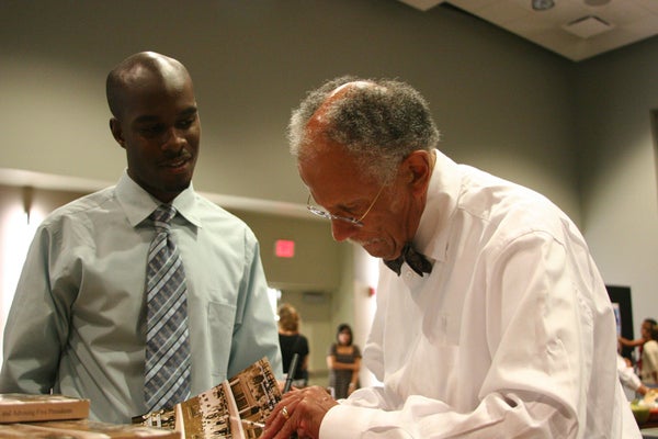 Warren signing his autobiography.