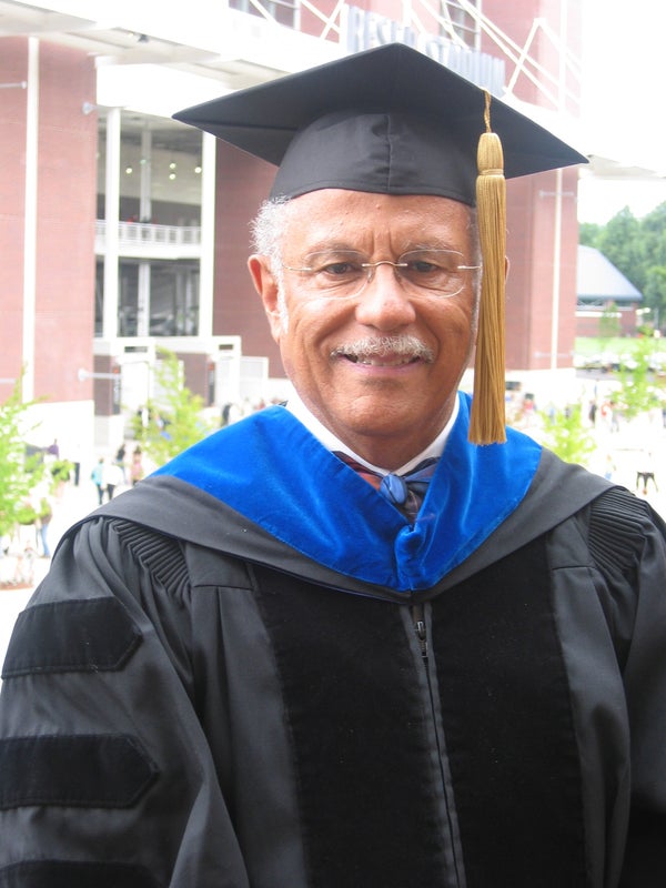 Warren receiving an Honorary Doctorate Medal from Oregon State University.