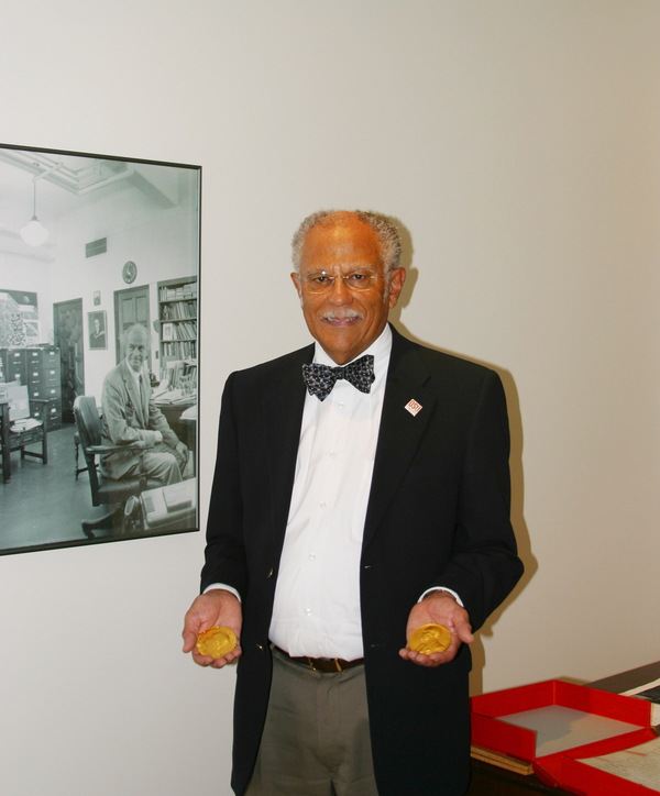 Warren Washington visited Oregon State University special collections library and while there had an opportunity to hold Linus Pauling's two Nobel prizes.