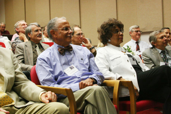 Warren (foreground) and his wife, Mary, take in one of the symposium talks during his 2007 symposium