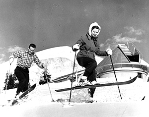 Walter and Janet Roberts skiing in front of the original Climax site, 1941
