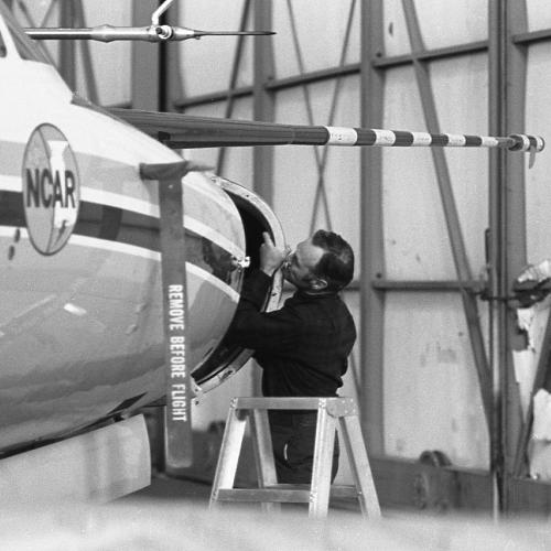 Person works on the nose of an aircraft.