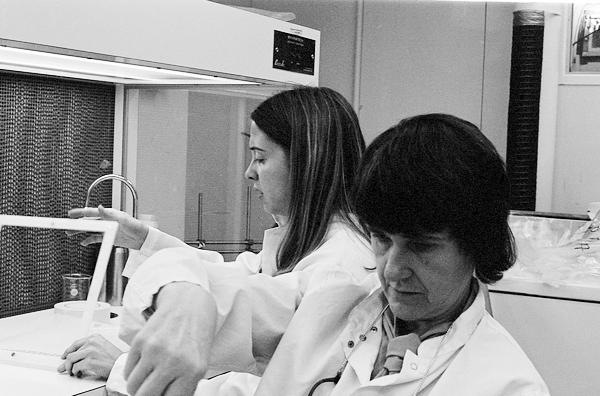 Two women at work in a lab. 