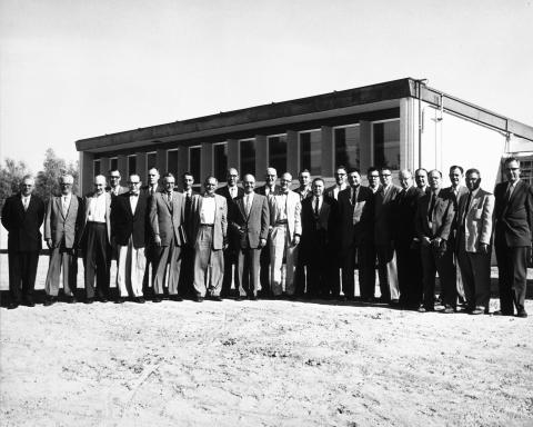UCAR's original 14 university members stand outside in front of a building in Tucson, Arizona.