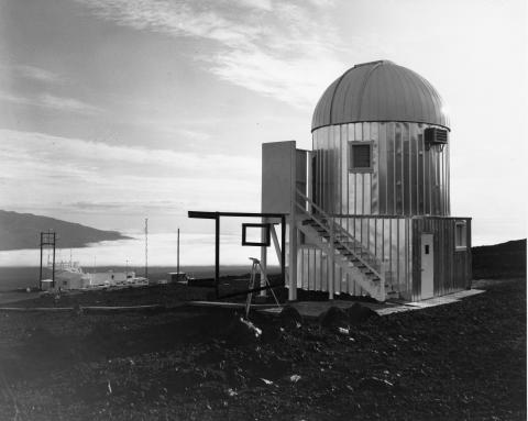 Photograph of the observatory dome with the ocean in the background