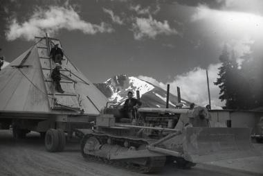 Observatory dome being transported to the observatory site at Climax by workers.